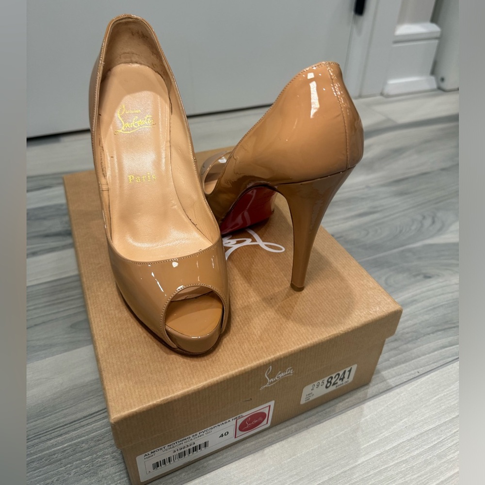 Christian Louboutin tan heels in size 40.